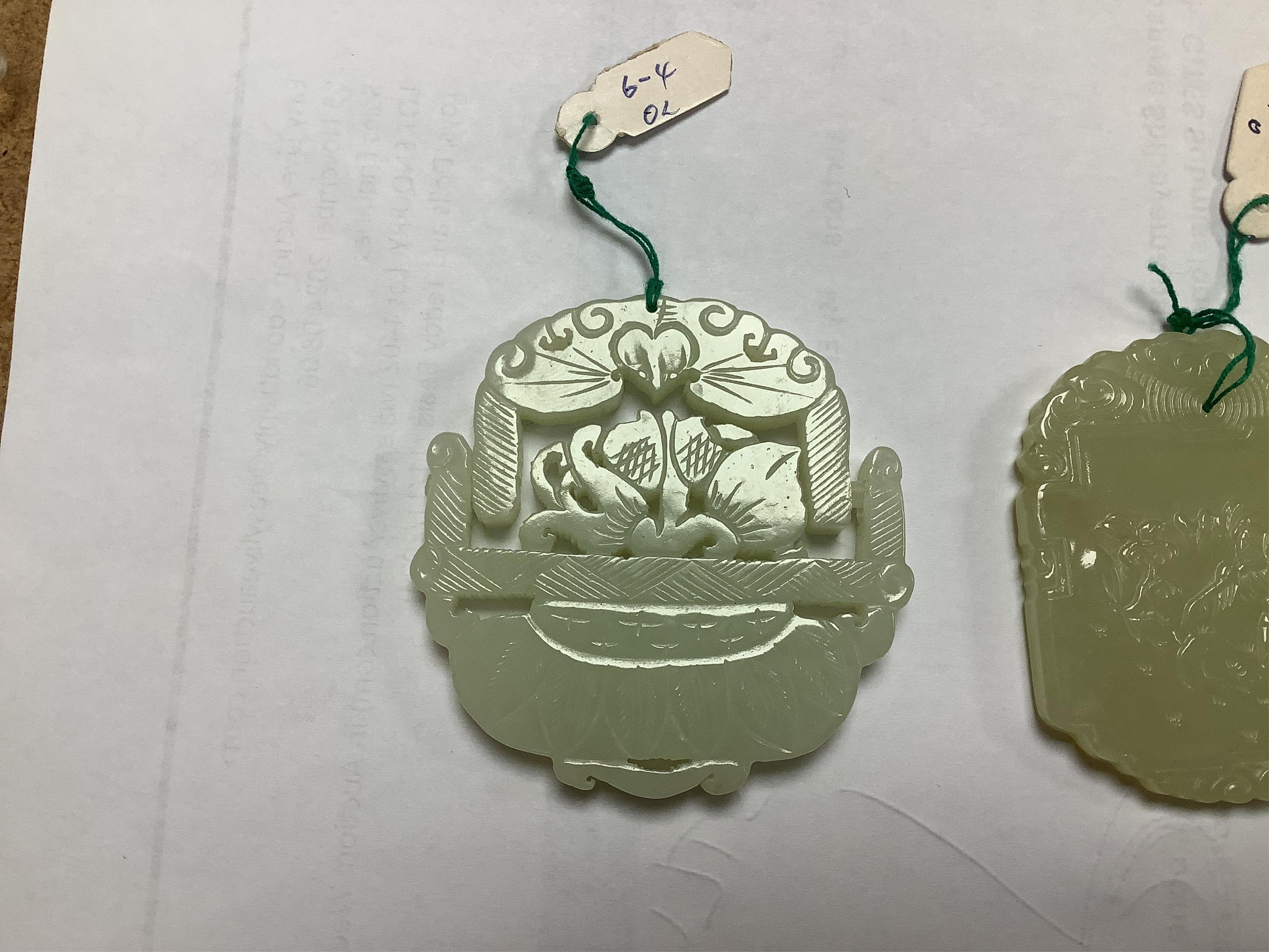 Two Chinese jade pendants, one articulated, largest 5.5cm high. Condition - good